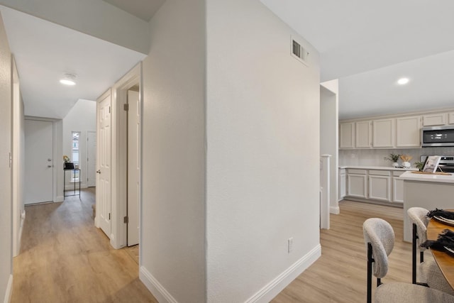 968 E Muncie, Fresno, CA 93720 - hall featuring visible vents, light wood-style flooring, and baseboards