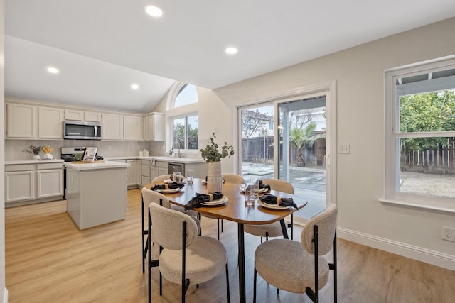 968 E Muncie, Fresno, CA 93720 - dining room featuring vaulted ceiling, light wood-style flooring, baseboards, and recessed lighting