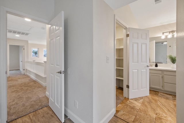 968 E Muncie, Fresno, CA 93720 - interior space with a walk in closet, visible vents, baseboards, and vanity