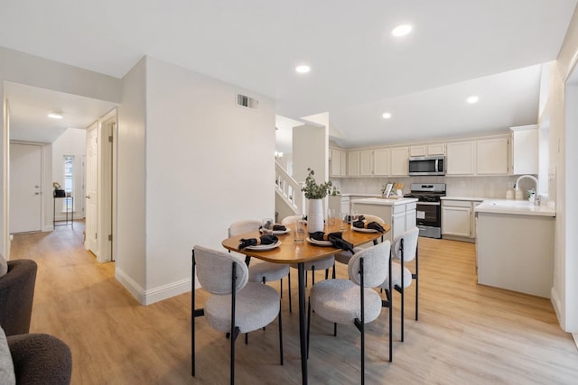 968 E Muncie, Fresno, CA 93720 - dining space with baseboards, recessed lighting, light wood-style floors, and visible vents