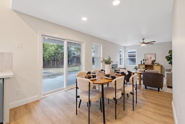 968 E Muncie, Fresno, CA 93720 - dining room with baseboards, light wood-type flooring, and a healthy amount of sunlight
