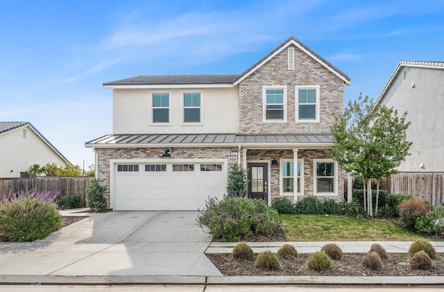 view of front of home with a garage and a front yard