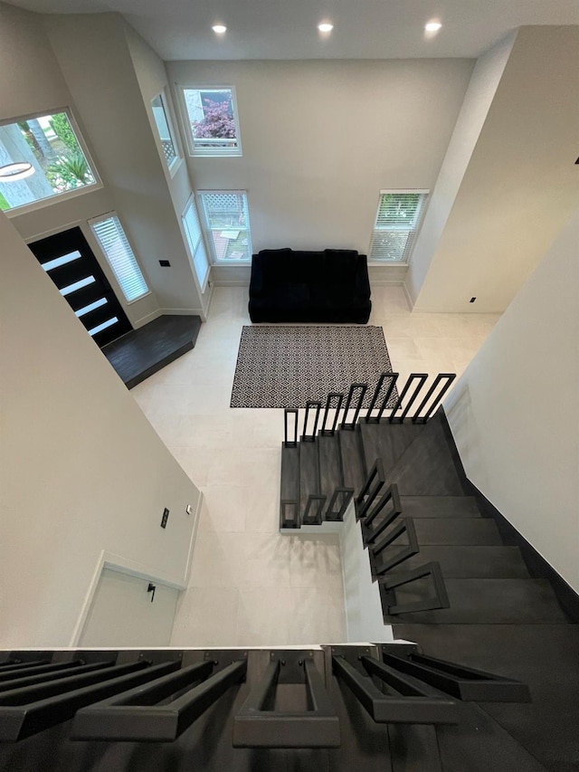 living room with a high ceiling