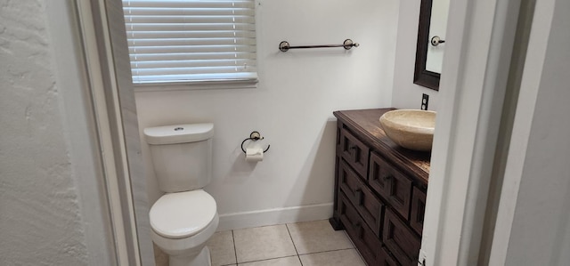 bathroom with vanity, tile patterned floors, and toilet