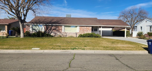 ranch-style home featuring a carport and a front yard