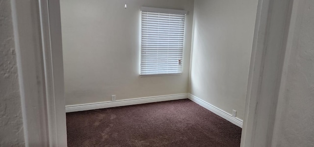 unfurnished room with a baseboard radiator and carpet flooring