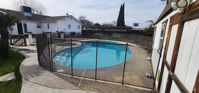 view of pool featuring an in ground hot tub and a patio