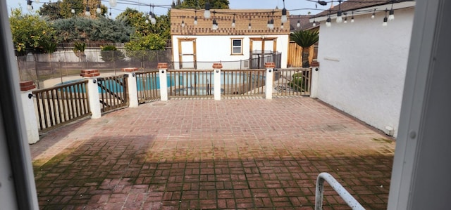 view of patio / terrace with a fenced in pool