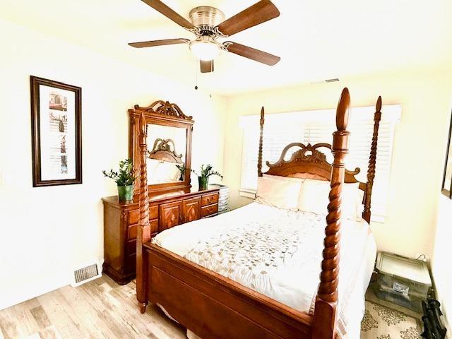 bedroom featuring ceiling fan and light wood-type flooring