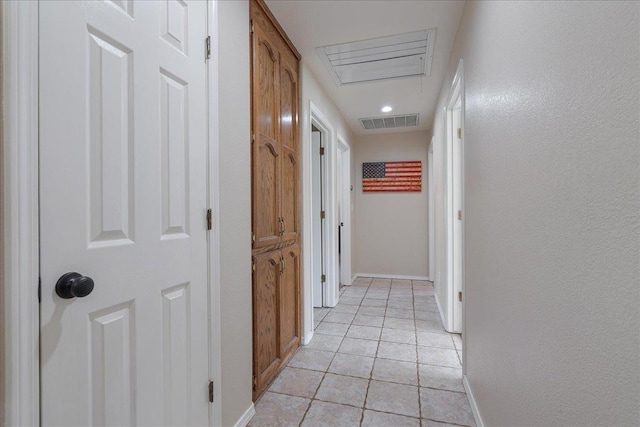 hallway featuring light tile patterned flooring