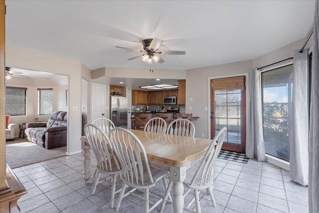 dining space featuring ceiling fan