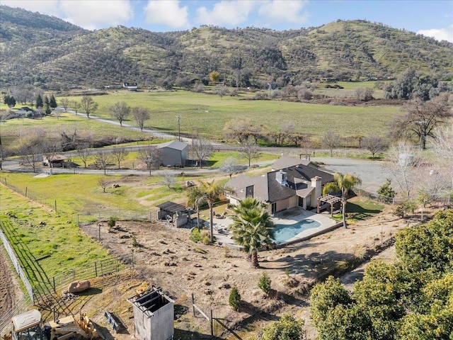 drone / aerial view featuring a rural view and a mountain view