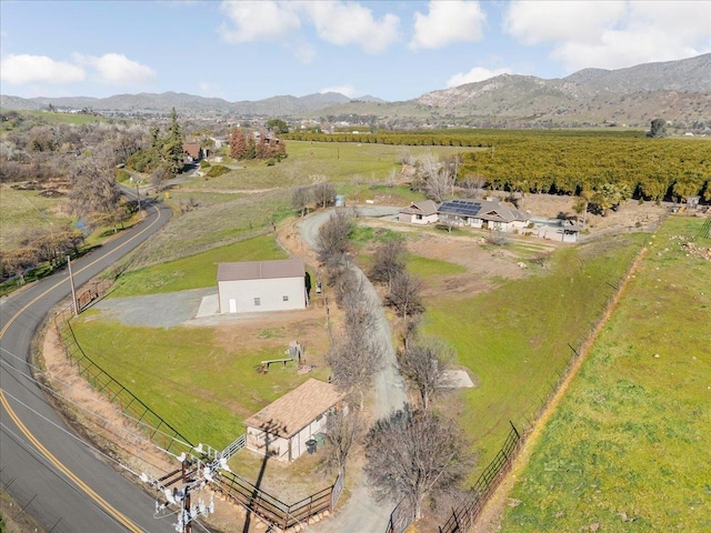 drone / aerial view featuring a mountain view and a rural view