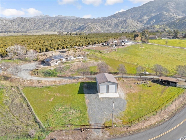 drone / aerial view with a mountain view and a rural view