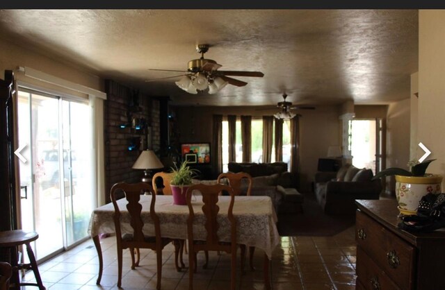 1875 Storey Rd, Madera, CA 93638 - dining area featuring tile patterned flooring, a ceiling fan, and a wealth of natural light
