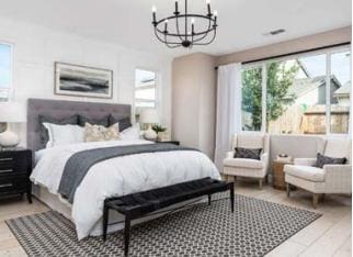 bedroom with a notable chandelier