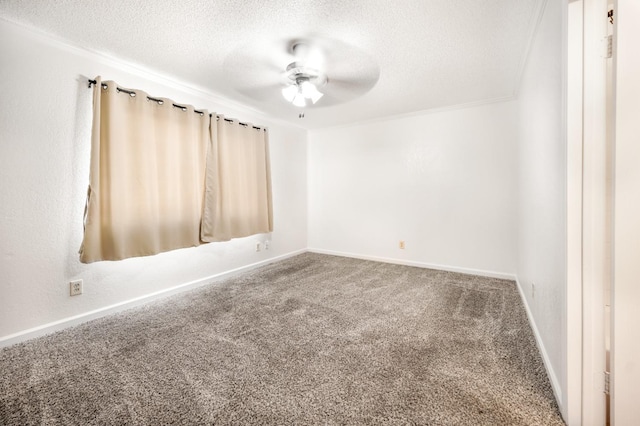 carpeted empty room with ceiling fan, ornamental molding, and a textured ceiling