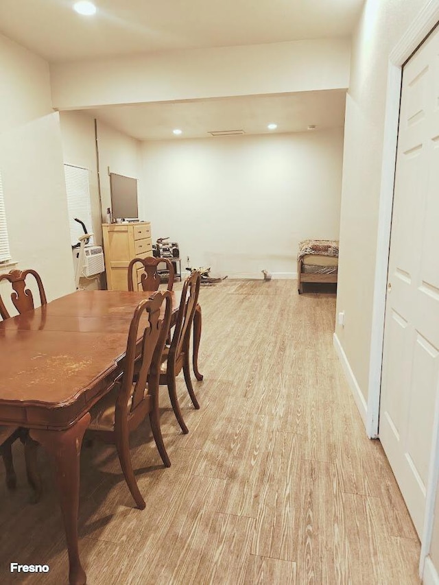 dining space with light hardwood / wood-style floors