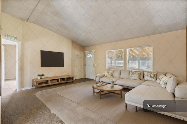 living room featuring vaulted ceiling