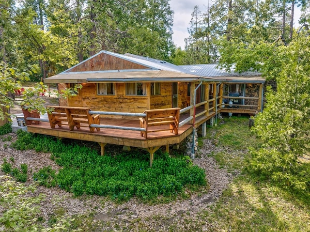 rear view of property with a deck