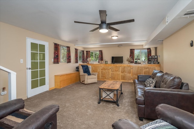 carpeted living room featuring ceiling fan