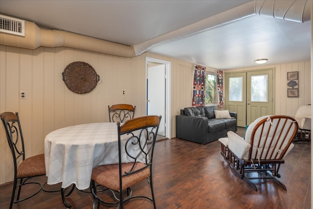 dining area with dark hardwood / wood-style flooring