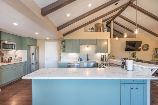 kitchen featuring stainless steel appliances, light stone countertops, sink, and beam ceiling