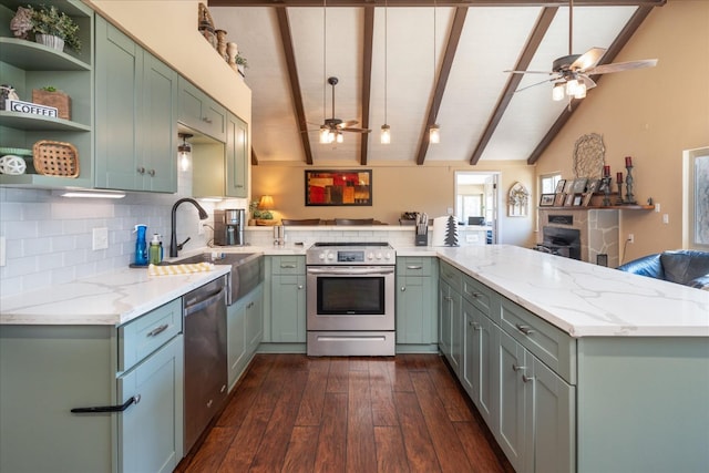 kitchen featuring light stone counters, stainless steel appliances, kitchen peninsula, and sink