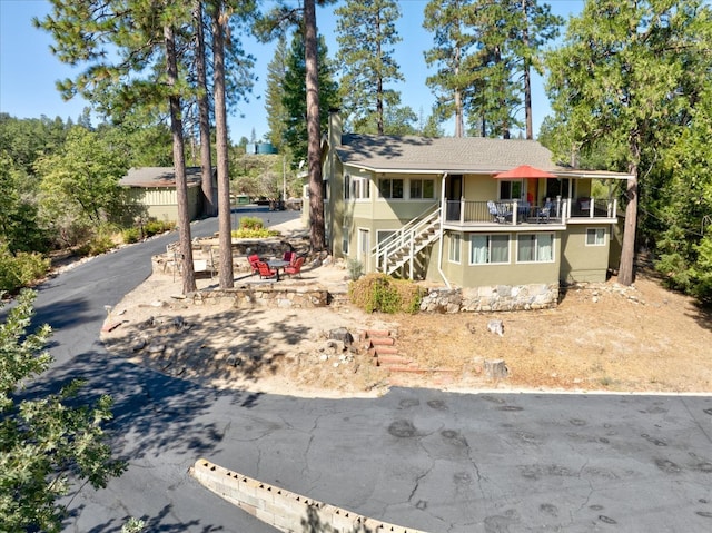 view of front of home with a balcony