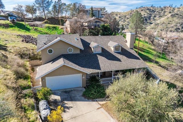 view of front facade featuring a garage and a mountain view