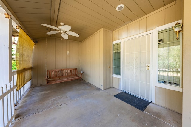 property entrance with ceiling fan