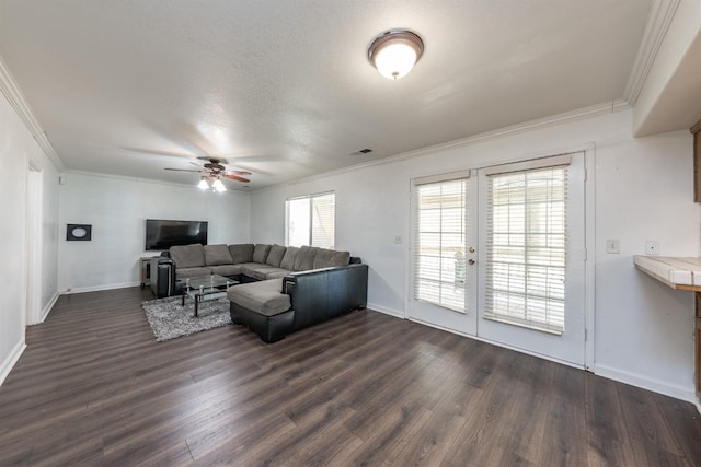 living room with crown molding, dark wood-type flooring, and french doors