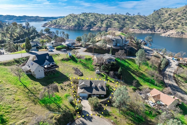 birds eye view of property featuring a water and mountain view