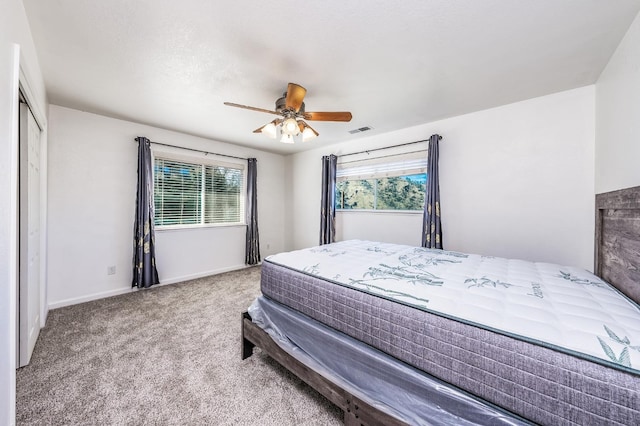 carpeted bedroom with ceiling fan