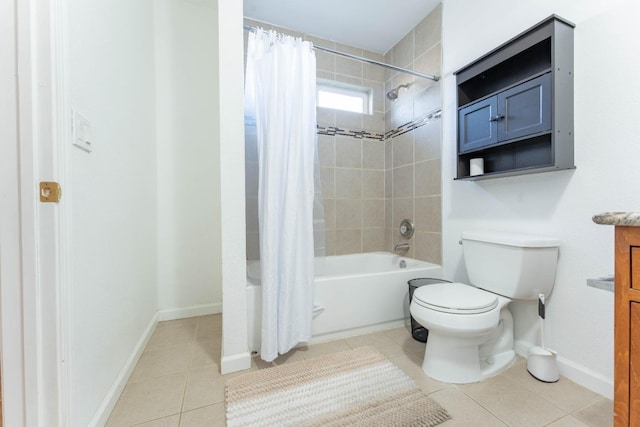 full bathroom featuring tile patterned floors, vanity, toilet, and shower / bath combo with shower curtain