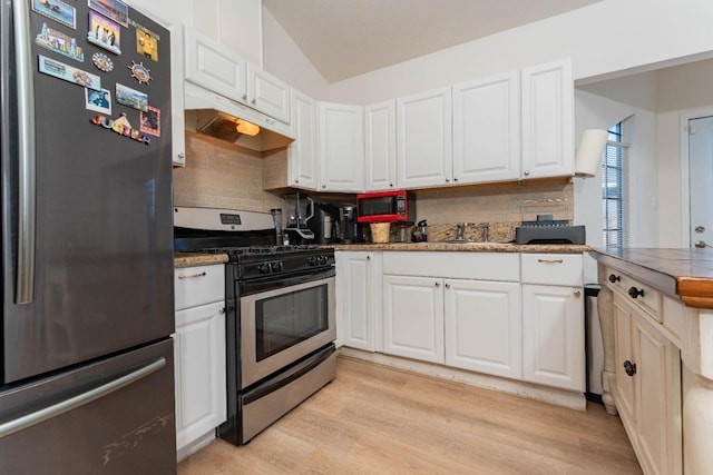 kitchen with white cabinetry, tasteful backsplash, stainless steel appliances, and light hardwood / wood-style floors