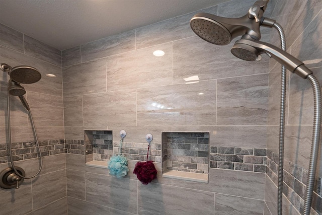 bathroom with tiled shower