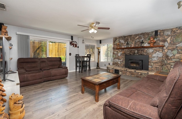 living room with ceiling fan and light hardwood / wood-style floors