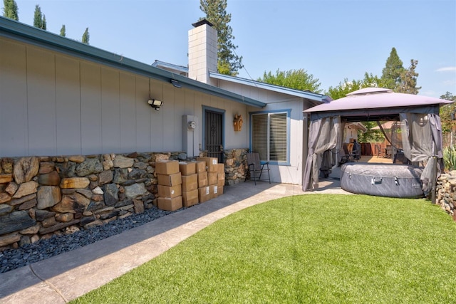 exterior space with a gazebo and a yard