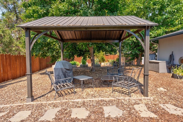 view of patio with area for grilling and a gazebo