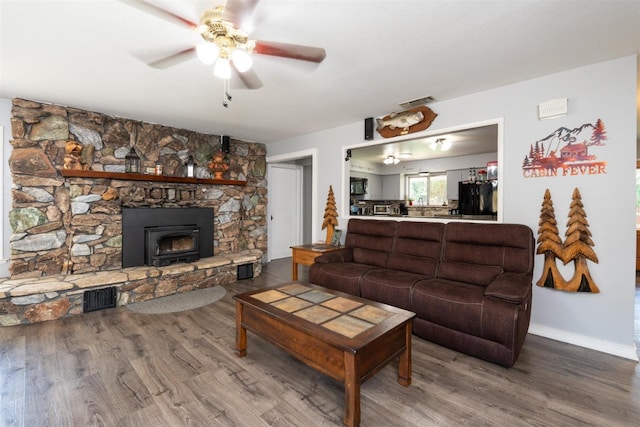 living room with hardwood / wood-style floors and ceiling fan