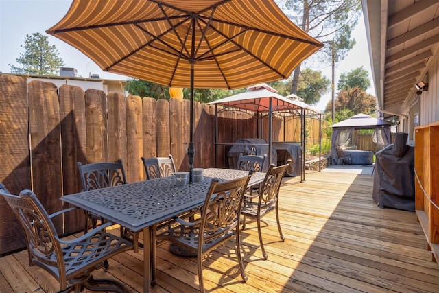 wooden deck featuring a gazebo