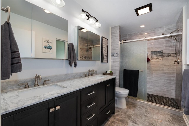 bathroom featuring walk in shower, vanity, and toilet