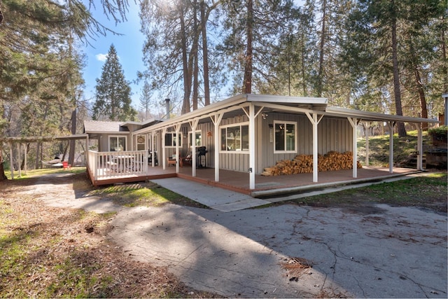 back of house featuring a wooden deck