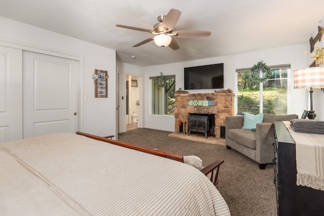 bedroom with carpet floors, ceiling fan, and a closet