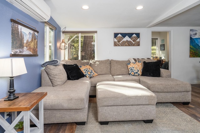 living room featuring dark wood-type flooring and a wall unit AC