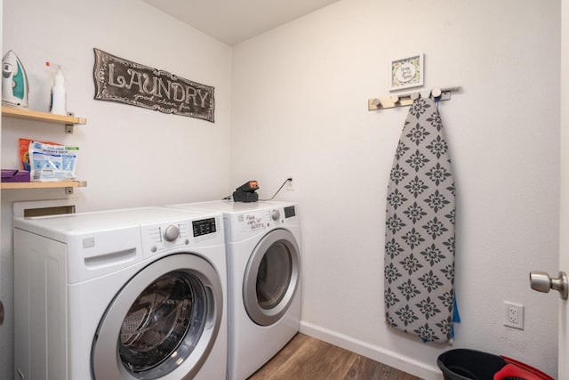 laundry room featuring dark wood-type flooring and independent washer and dryer