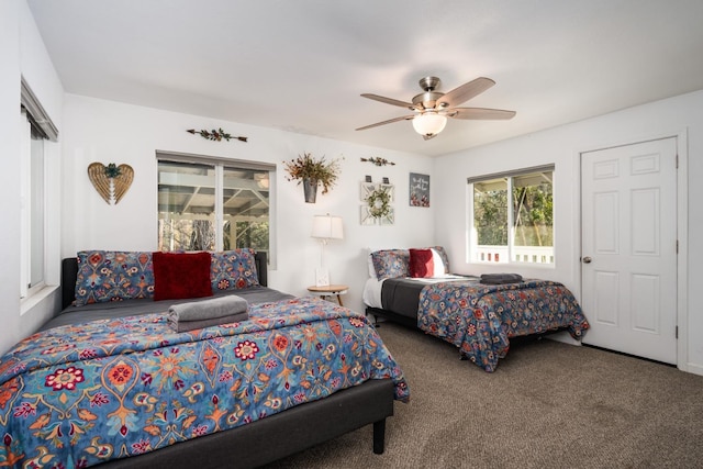 bedroom featuring ceiling fan and carpet