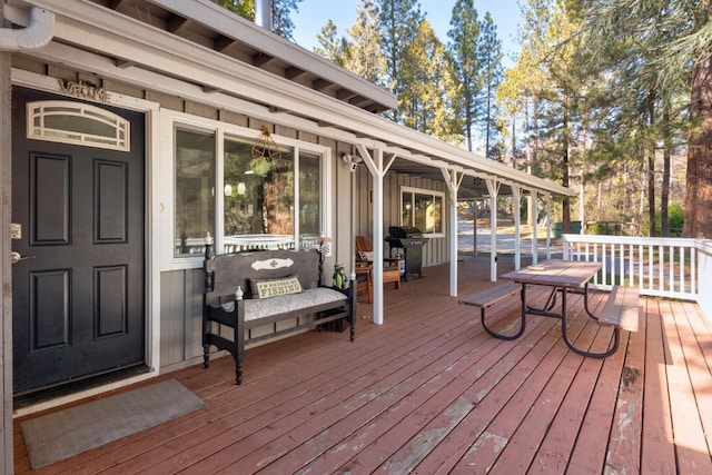 wooden terrace featuring grilling area