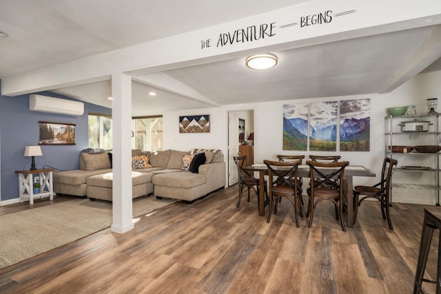 dining room featuring beamed ceiling, dark hardwood / wood-style floors, and a wall unit AC